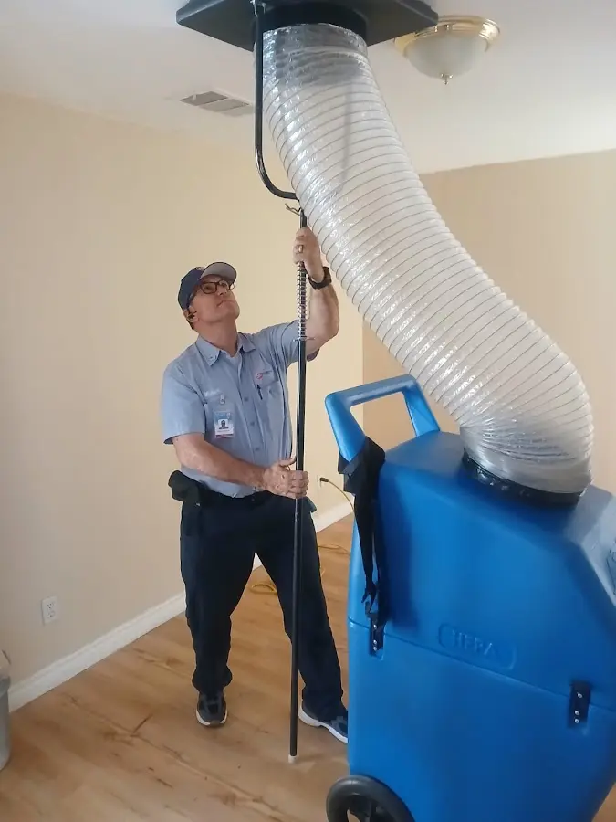 Furnace Tune-Up technician using HEPA equipment in Birmingham